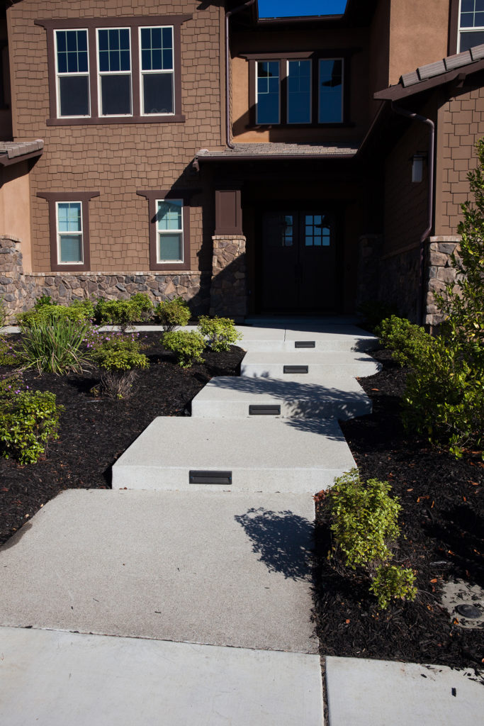 Washed concrete entry way. Built in path lights. San Marcos, Ca