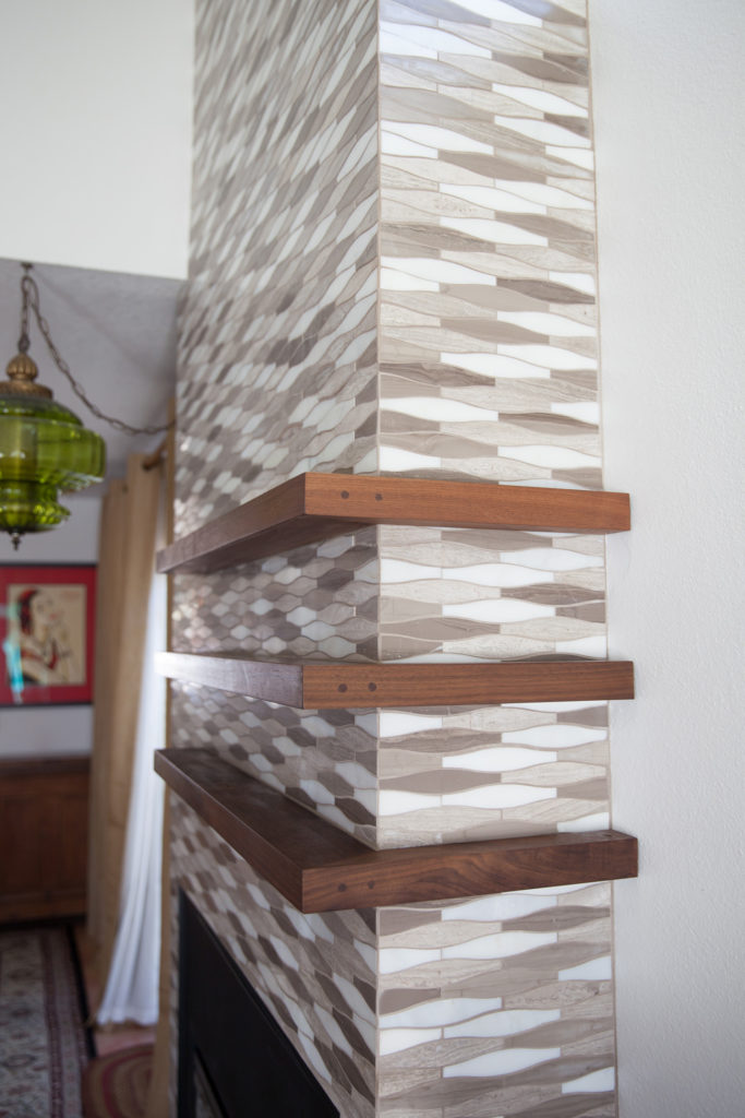 Marble Tile Mosaic. Interior fireplace. Custom walnut wood shelves.