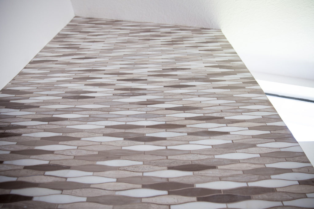 Marble Tile Mosaic. Interior fireplace. Custom walnut wood shelves.