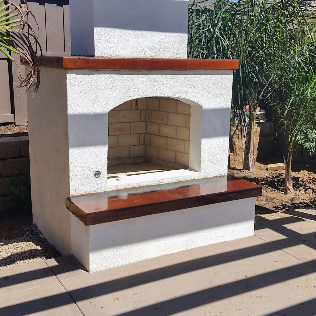 Acid stained concrete hearth. Outdoor firplace.