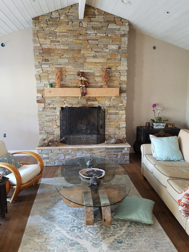 Natural Quartz stone. Stacked ledger. Dry stack veneer. Interior fireplace. Rustic wood mantel. Honed Travertine hearth.